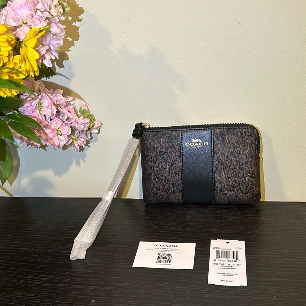 Coach brown and black leather wristlet
